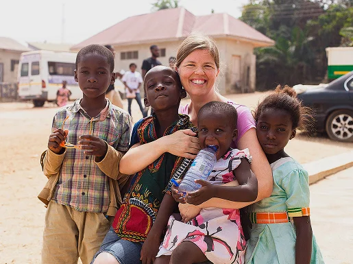 CAN chaplain praying with displaced believers inside relief camp